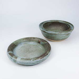 Blue pottery dog food bowl with matching dog water bowl