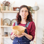 Picture of potter Tiziana holding a pottery bowl