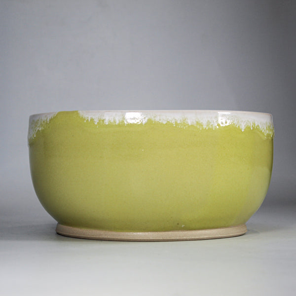 Handmade yellow and white pottery bowl