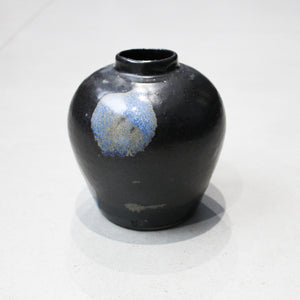 Small black vase with blue detail
