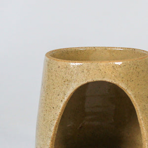 Close up of speckled taupe glaze on handmade pottery wax melt burner 