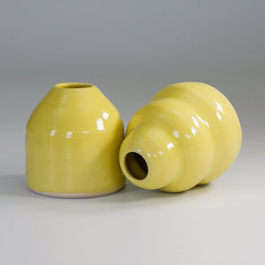 Pair of small yellow pottery bud vases