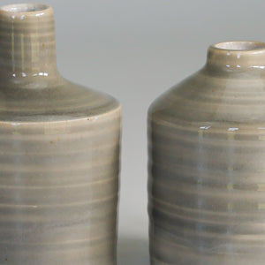 Close up of grey handmade small bud vases 