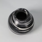Load image into Gallery viewer, View from above of handmade mini moon jar in black glaze with white swirls
