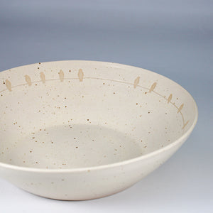 Speckled salad bowl with bird motif