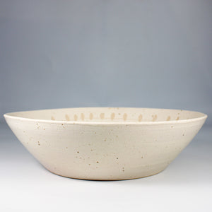 Speckled salad bowl with bird motif