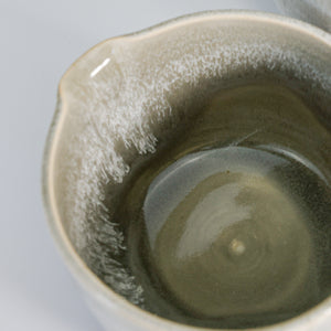 Close up of inside of grey glazed pottery gravy jug 
