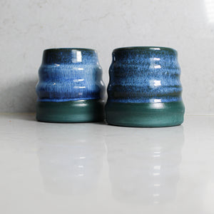 Pair of green and blue ceramic mini wobble vases 