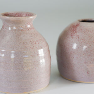 Close up of purple small handmade ceramic bud vases 