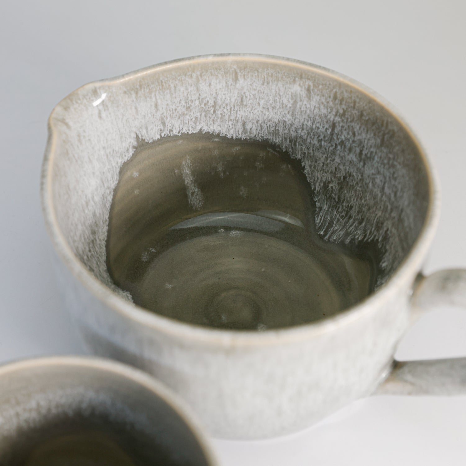 Inside view of large grey glazed pottery gravy jug 