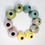 Load image into Gallery viewer, Small handmade pottery vases in choice of colours arranged in a circle
