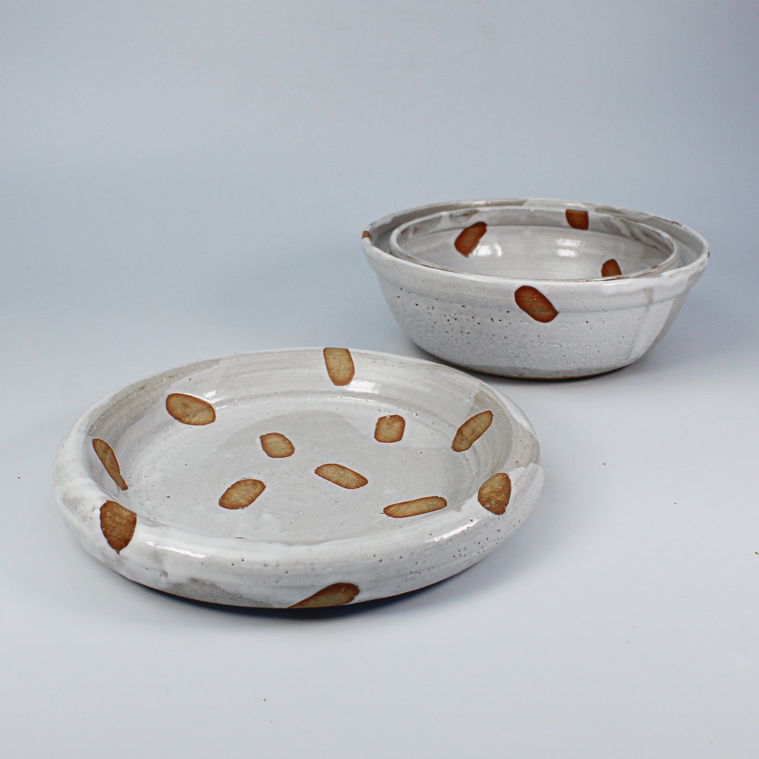 Pottery spotted dog food bowl and matching dog water bowl