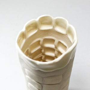 Inside view of tall slim white handmade porcelain vase 