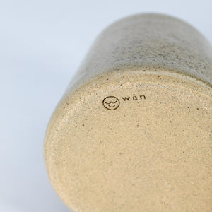 Bottom of handmade pottery wax melt burner showing makers mark